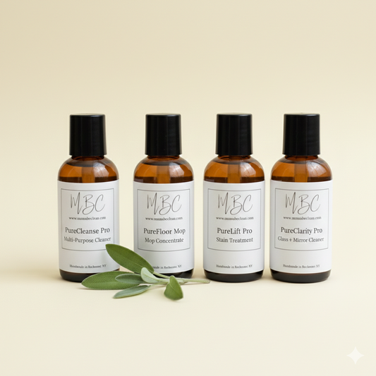 Four bottles of MBC cleaning products on a beige background with green leaves.